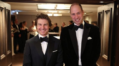 Prince William (r.) and Tom Cruise at a gala dinner hosted by London's Air Ambulance Charity.