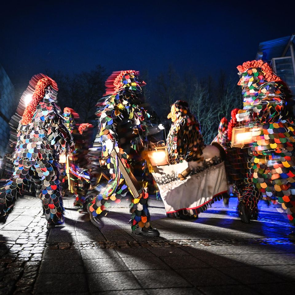 Konstanz, Germany.  What shimmers so colorfully through the night and wind?  It's the Blätzlebuebe on the dirty Dunschig!  The dance of the fools started in the early hours of the morning with music, rattles and ringing of bells.  The highlight is the lantern dance.