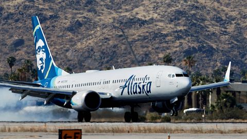 An Alaska Airlines Boeing 737-9 Max at Palm Springs Airport.  A fuselage part of one of the airline's identical aircraft recently came loose during a flight